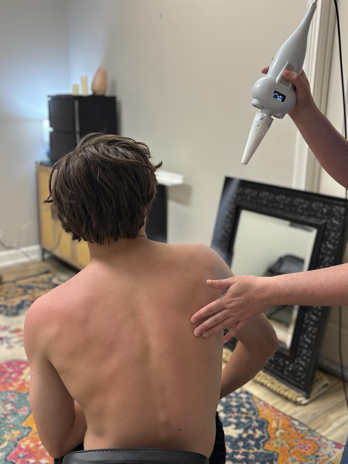 Rosewater Wellness Spa cryotherapy applicator being used in a calm treatment setting